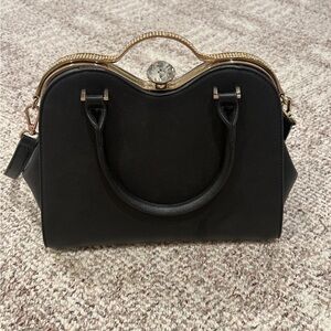 Elegant Black Handbag with Gold Accents